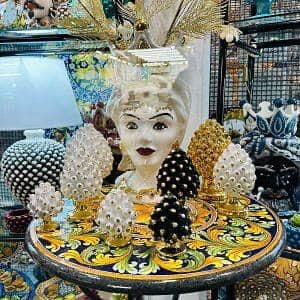 ceramic head and pinecones